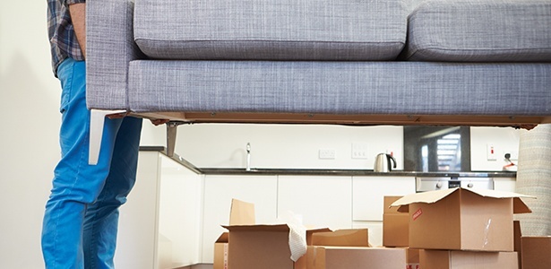 Movers moving sofa